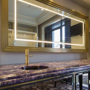 Gold mirror by Bomham Interiors